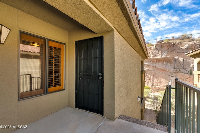 property entrance with a balcony