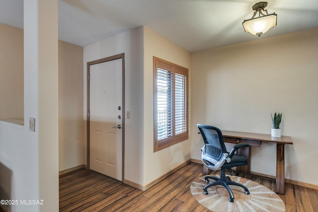 office with dark hardwood / wood-style floors