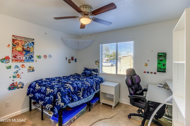 bedroom featuring ceiling fan, baseboards, and concrete flooring