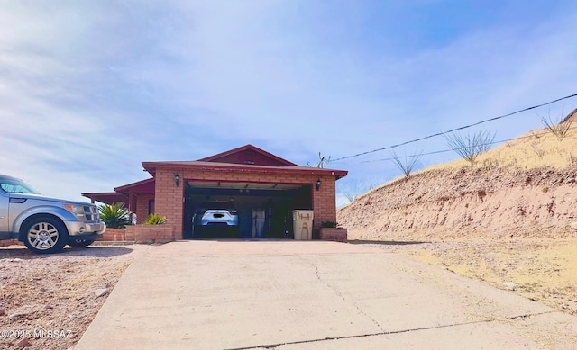 exterior space featuring concrete driveway