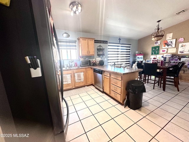 kitchen with visible vents, light brown cabinetry, appliances with stainless steel finishes, light tile patterned flooring, and a peninsula