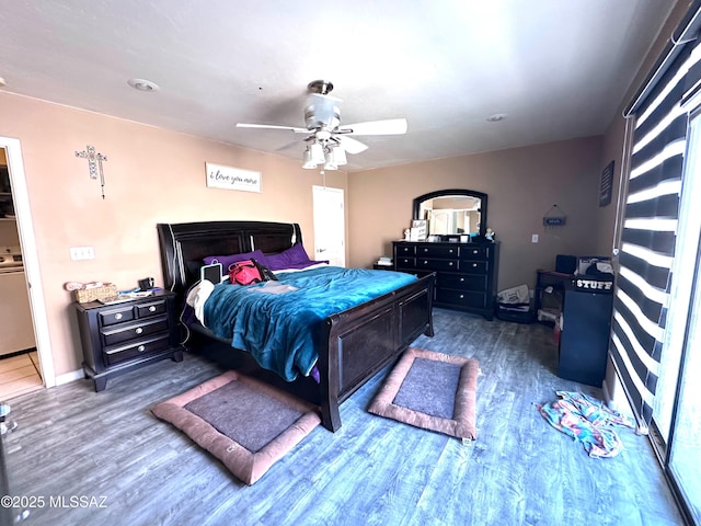 bedroom featuring ceiling fan, baseboards, and wood finished floors