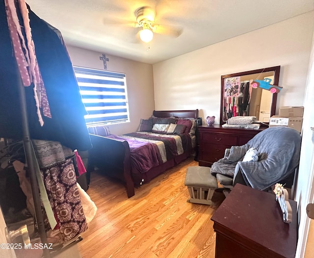 bedroom with ceiling fan and wood finished floors