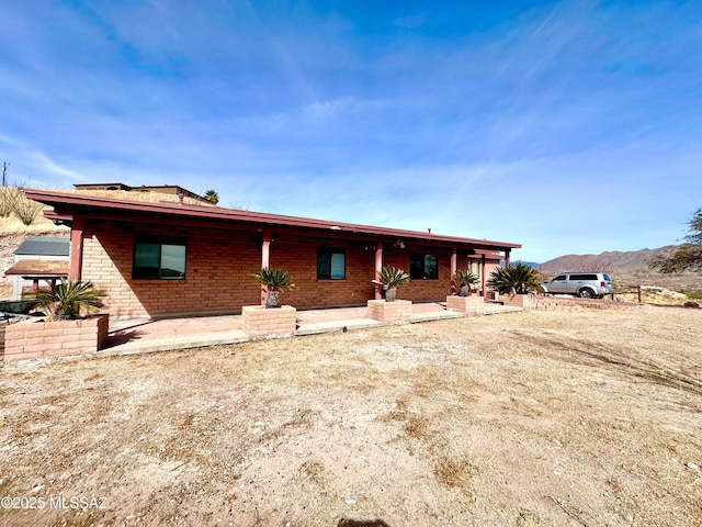 view of front of home featuring brick siding