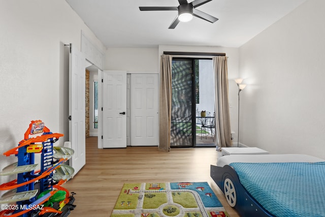 bedroom featuring ceiling fan, access to outside, and light hardwood / wood-style floors