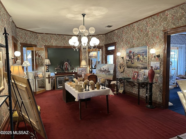 carpeted dining space with visible vents, crown molding, a notable chandelier, and wallpapered walls