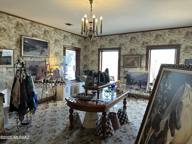 office area with an inviting chandelier, carpet flooring, visible vents, and crown molding