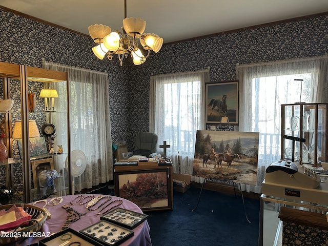 bedroom with a notable chandelier, carpet floors, and wallpapered walls