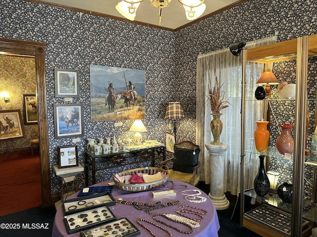 dining area featuring a chandelier and crown molding