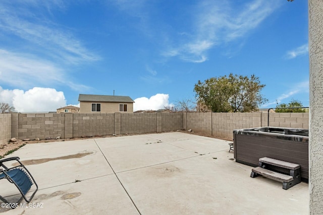 view of patio / terrace with a hot tub