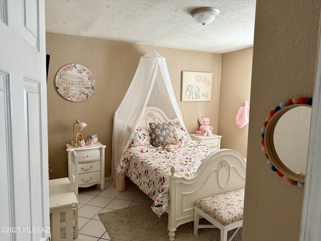 tiled bedroom with a textured ceiling