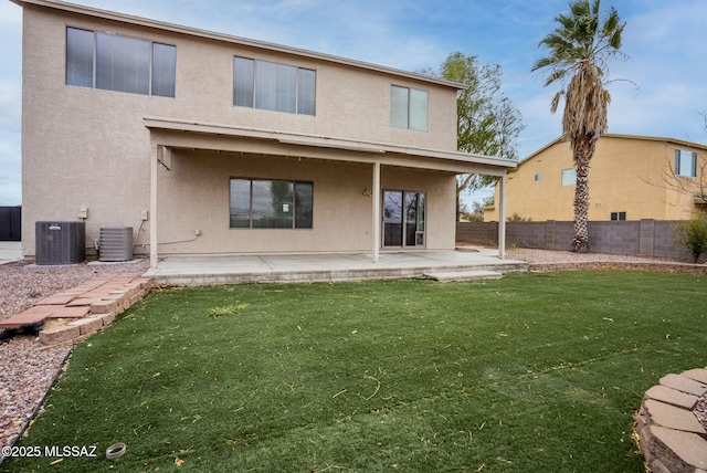 back of property featuring a patio, central AC unit, fence, and stucco siding