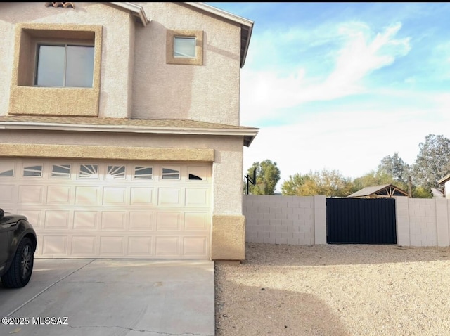 view of side of property with a garage