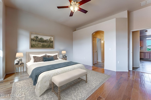 bedroom featuring wood-type flooring and ceiling fan