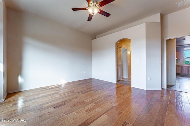 spare room with ceiling fan and light hardwood / wood-style floors