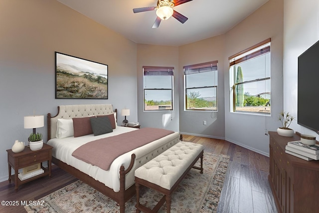 bedroom featuring ceiling fan and dark hardwood / wood-style flooring