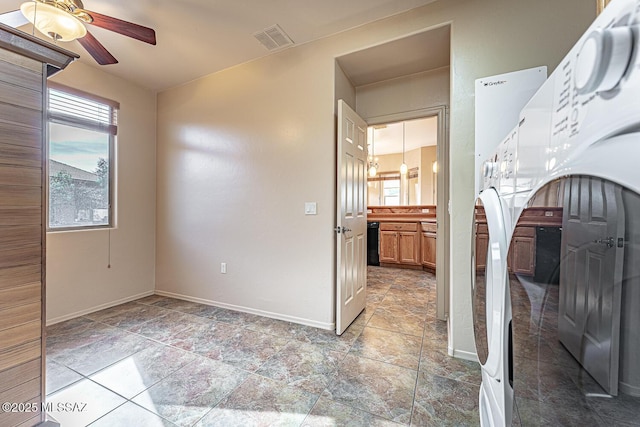 interior space with ceiling fan and washer / clothes dryer