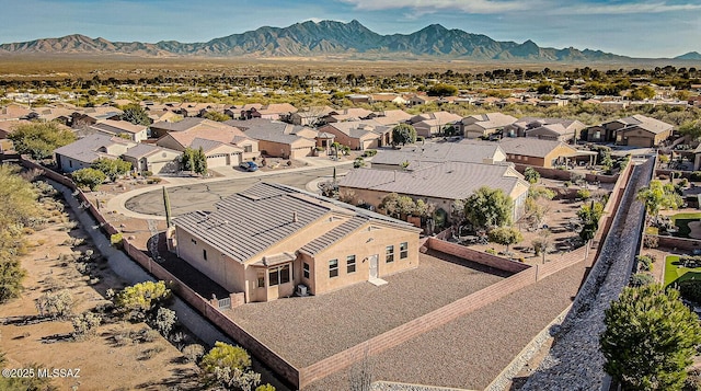 birds eye view of property with a mountain view