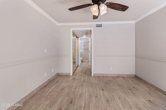 unfurnished room featuring ceiling fan, ornamental molding, and light wood-type flooring