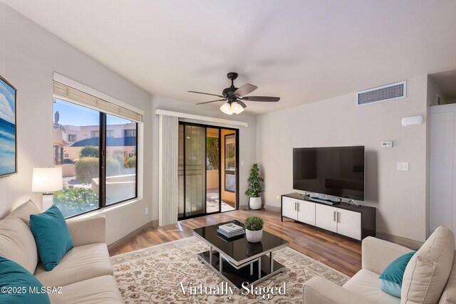 empty room with light hardwood / wood-style flooring and ceiling fan