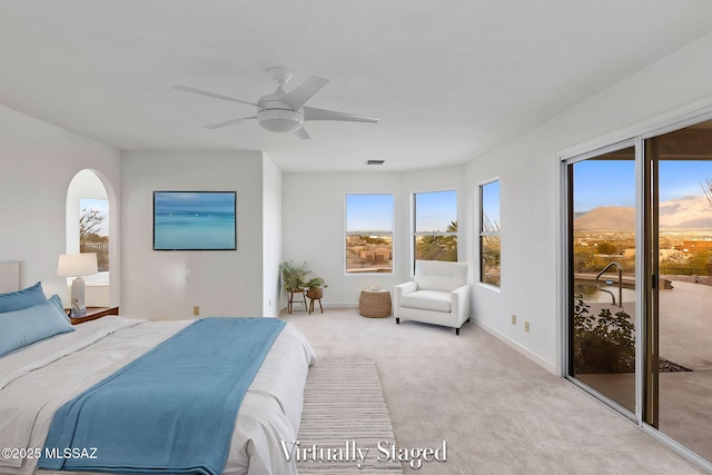 4725 N Placita De Concha, Tucson, AZ 85745 - bedroom with access to exterior, multiple windows, carpet flooring, and ceiling fan