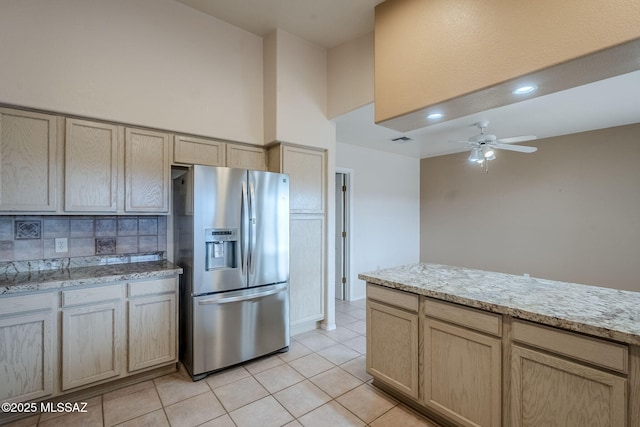 kitchen with stainless steel fridge, light tile patterned flooring, ceiling fan, and light brown cabinets