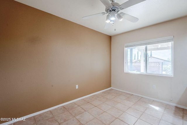 unfurnished room with ceiling fan and light tile patterned floors