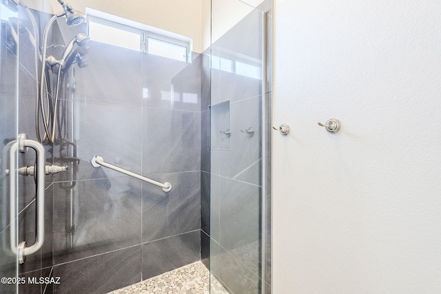 bathroom featuring an enclosed shower