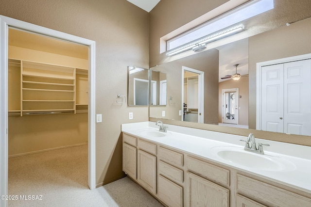 bathroom featuring vanity and ceiling fan