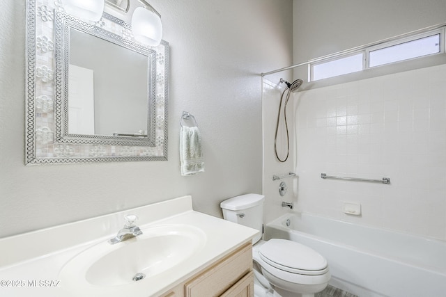 full bathroom with vanity, tub / shower combination, and toilet