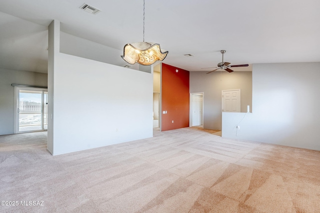 carpeted spare room featuring high vaulted ceiling and ceiling fan