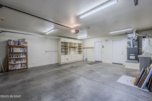 garage with heating unit, a garage door opener, and gas water heater