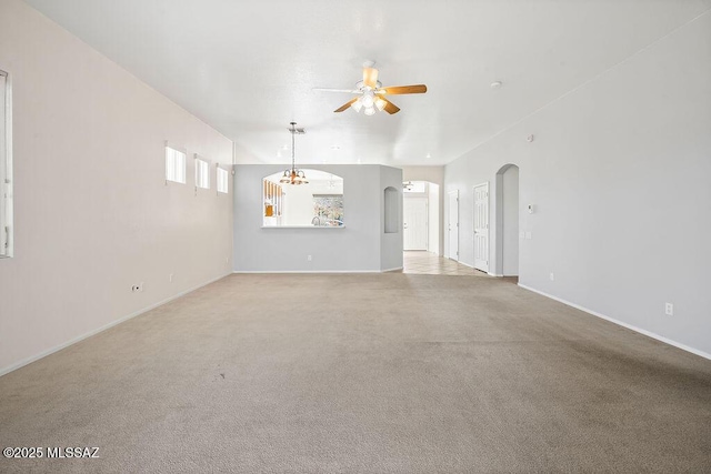 unfurnished living room featuring light carpet and ceiling fan