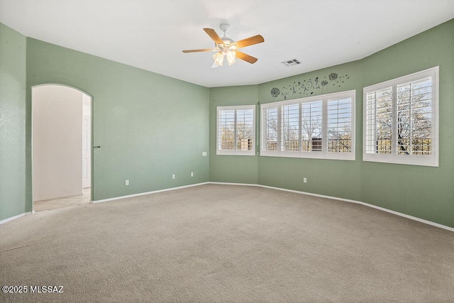 carpeted empty room with ceiling fan