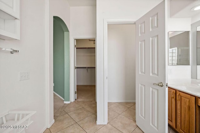 bathroom featuring tile patterned flooring and vanity