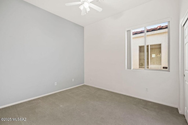 unfurnished room with carpet floors and ceiling fan