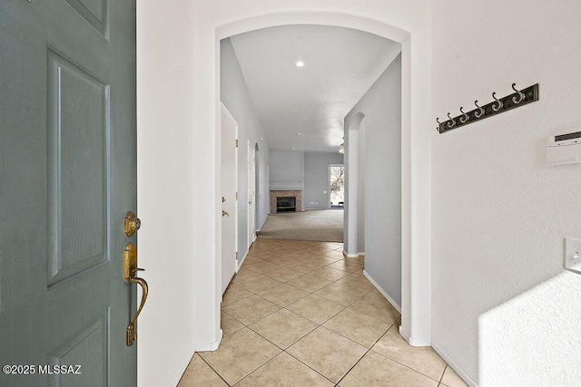 corridor featuring light tile patterned floors