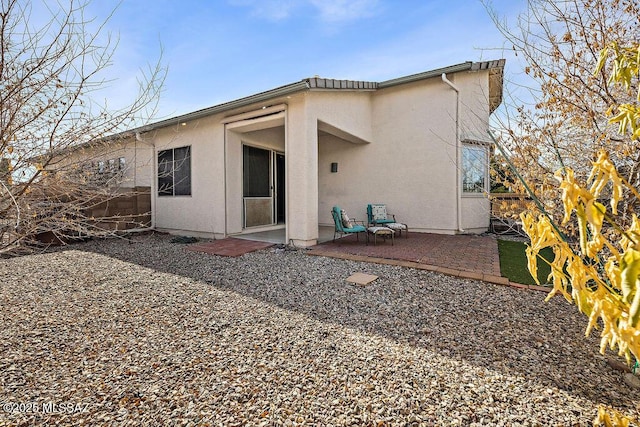 back of house with a patio area