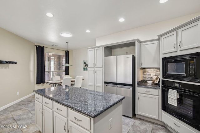 kitchen featuring dark stone countertops, backsplash, a center island, black appliances, and decorative light fixtures