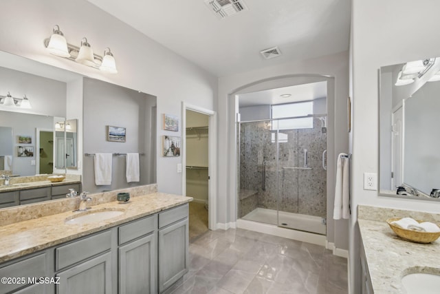 bathroom with vanity and an enclosed shower