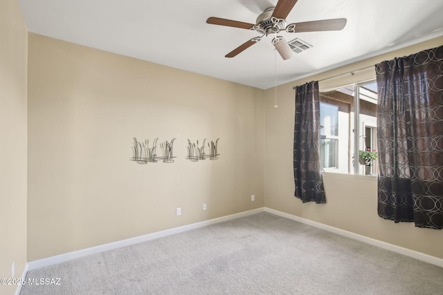 empty room with carpet floors and ceiling fan