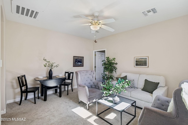 carpeted living room featuring ceiling fan