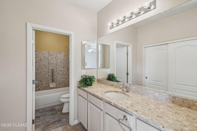 full bathroom featuring ceiling fan, shower / tub combination, vanity, and toilet