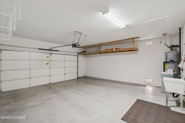 garage with sink, a garage door opener, and water heater