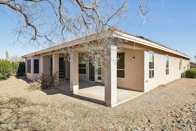 back of property featuring a patio