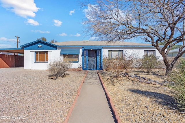 view of front of property featuring fence