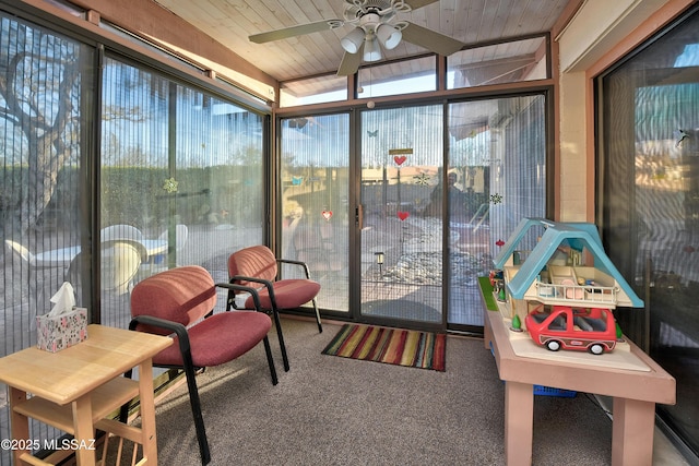 sunroom / solarium with wooden ceiling and ceiling fan