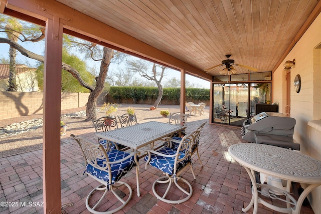 view of patio with area for grilling and ceiling fan