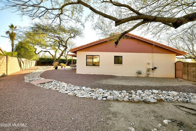 view of property exterior featuring a patio