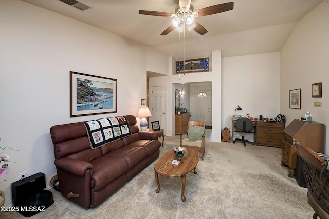 living room featuring lofted ceiling, carpet floors, and ceiling fan